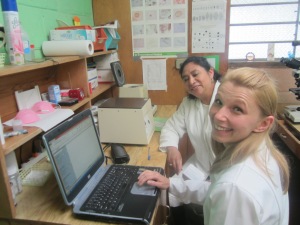 Lab Technician, Irma Mazariesgos and foreign student, Alex working in the lab